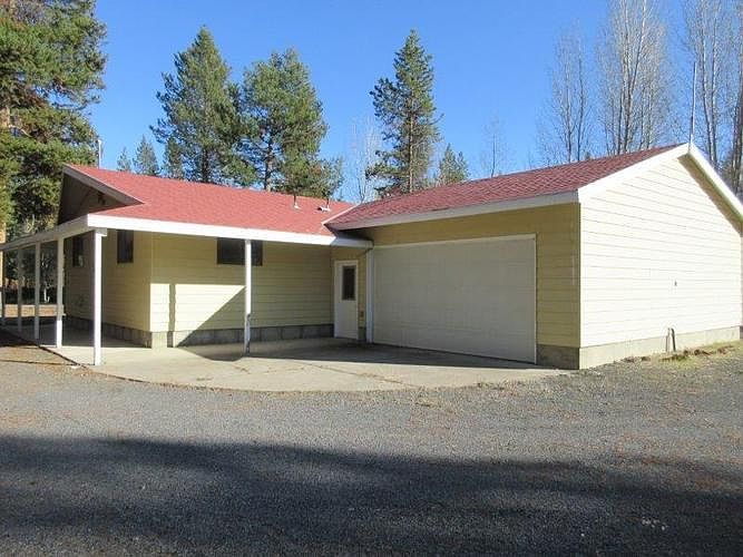 House has a 2 car attached garage and wrap around