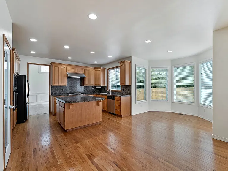 Open floor plan kitchen with granite