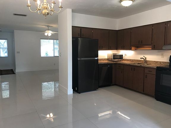 Another view of the kitchen with granite counter-tops, new appliances.