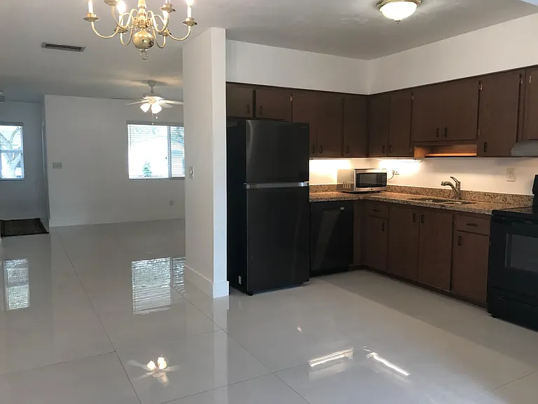 Another view of the kitchen with granite counter-tops, new appliances.