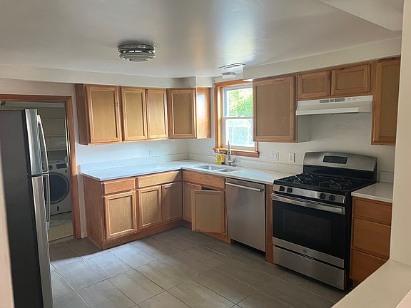 Everything is recently added - windows, stove, dishwaster, fridge, pantry, cupboards, tile floor. Room for kitchen table.