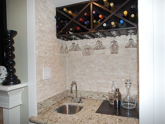 Wet bar with split-face travertine backslash