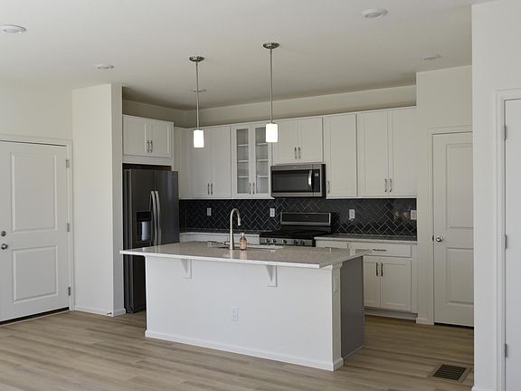 Quartz countertops, soft close cabinetry, stainless appliances