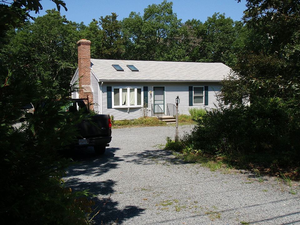 House set back from road with drive way designed for Class A motor home.
