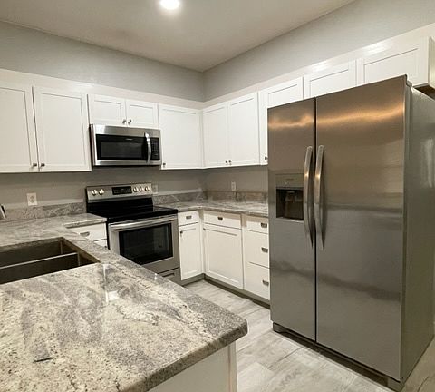 Remodeled Kitchen with Granite Counters . . .