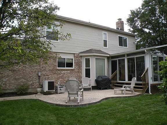 Patio w/stamped concrete; sunroom