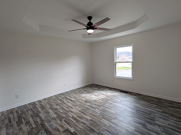 Large master bedroom with ensuite bath is one of three spacious bedrooms in this split floor plan home.