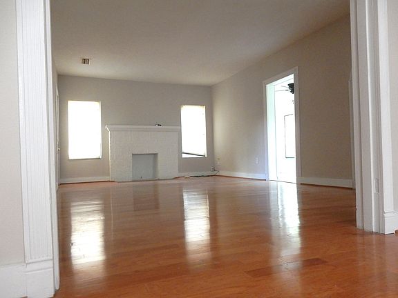 Family Room with Fireplace and Entrance to Sunroom