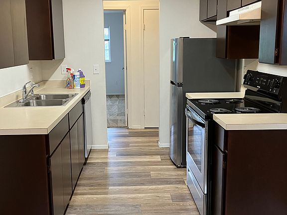updated kitchen with dishwasher, refrigerator, stove and oven.