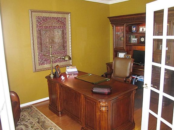 STUDY W/FRENCH DOORS - LOCATED ACROSS MAIN ENTRY FROM FORMAL DINING.