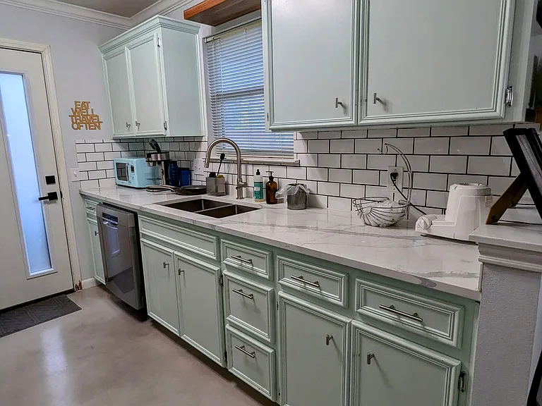 View of the kitchen area and appliances.