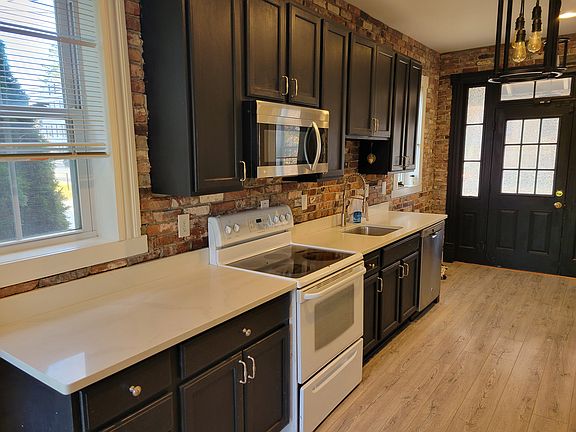 Kitchen. Front door shown