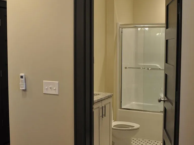 Bathroom with tub/shower fixture.