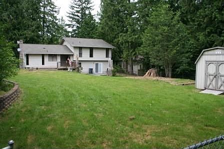 fenced backyard with shed