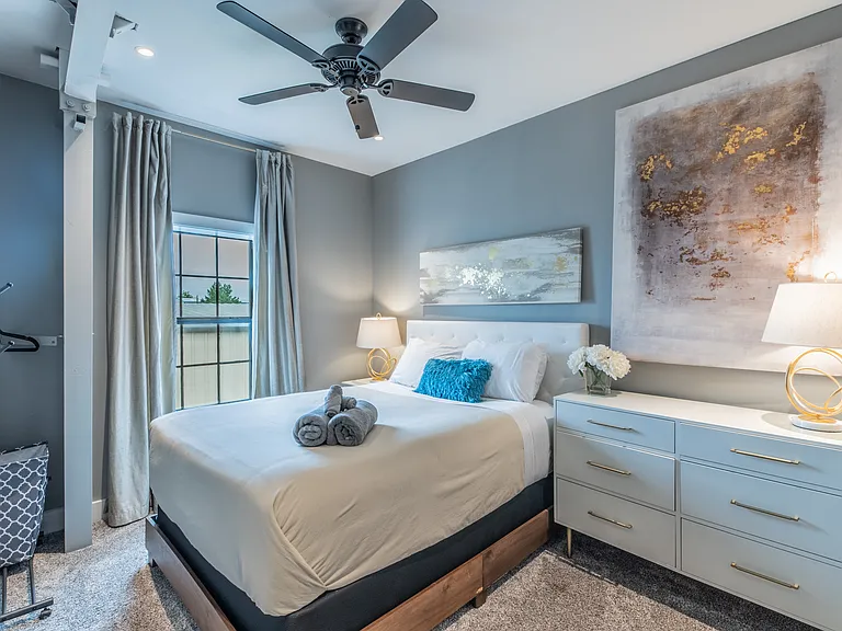 Bright and modern bedroom with stylish abstract decor.