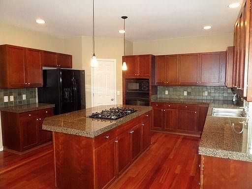 Chef's kitchen with large pantry.
