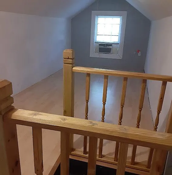 Upstairs room. Window unit has been upgraded to GE portable room air conditioner