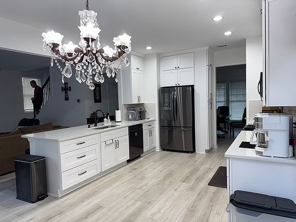 Newly renovated kitchen with new refrigerator, dishwasher, cabinets, counters and flooring.