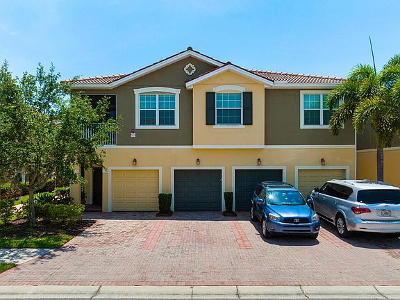 Tasteful front of townhome with upgraded tile roof