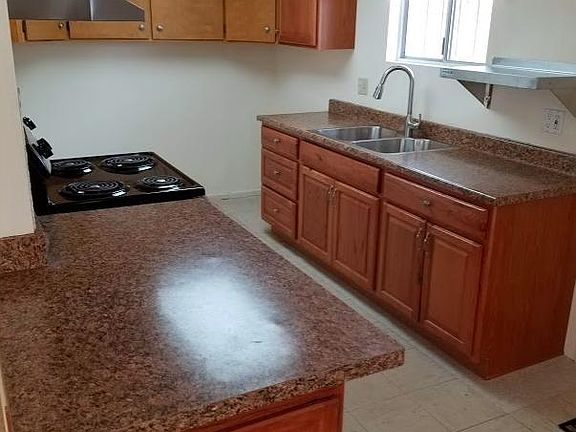 Renovated kitchen-electric range, laundry hook ups, and new 