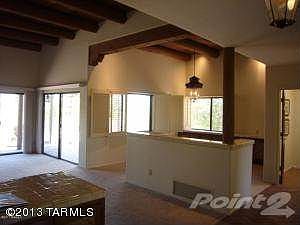 Dining room with beamed ceiling& light