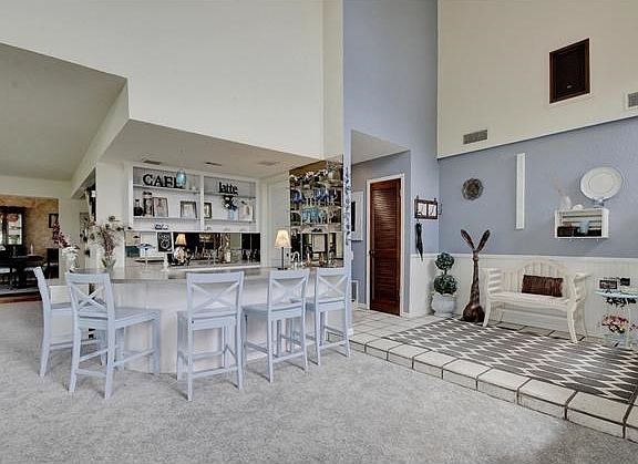 From living room, back at bar and front entryway.