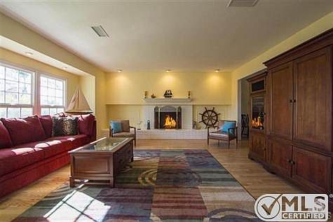 Living Room with raised hearth fireplace.