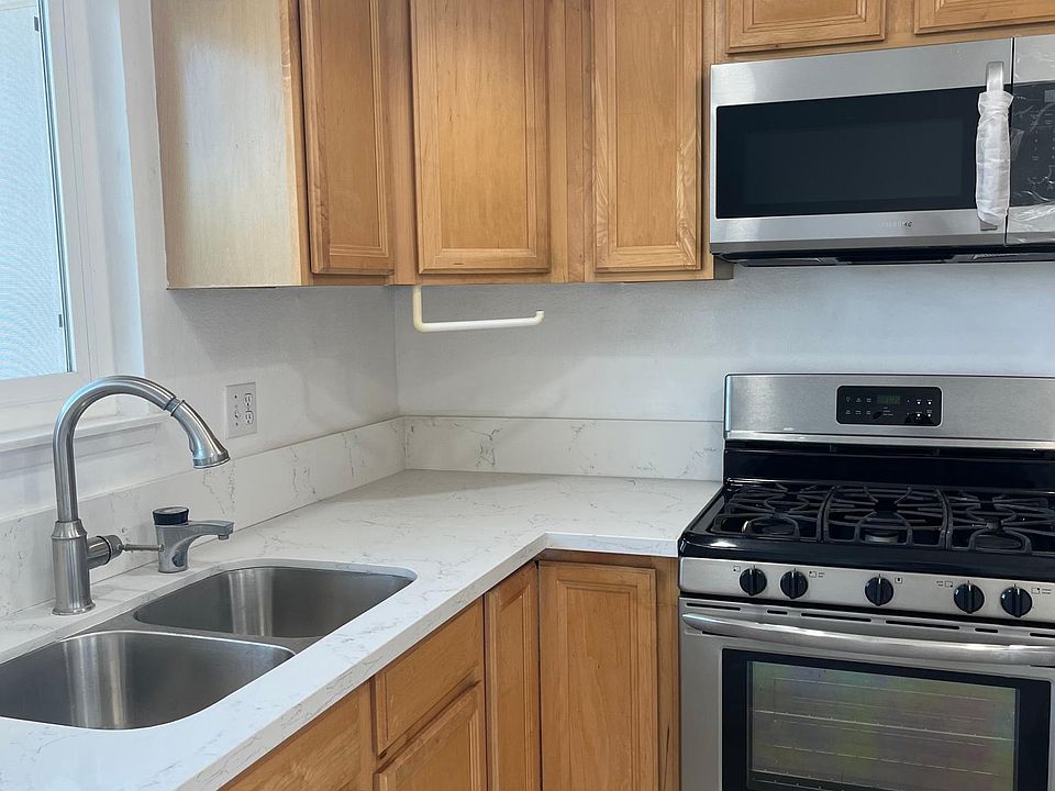 Kitchen with new counter tops and stainless steel appliance