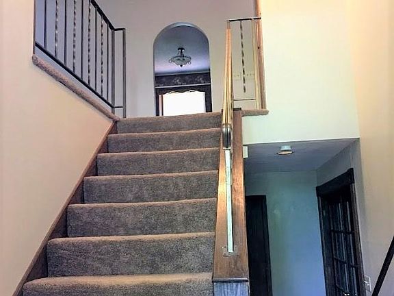 Entry leading down stairs