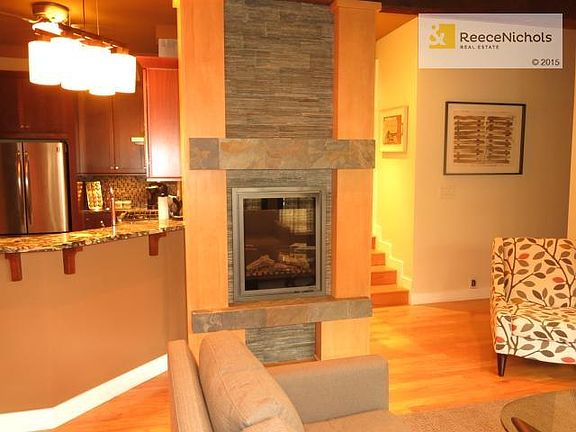 Electric fireplace with slate hearth and surround.
