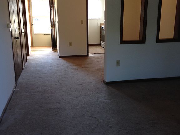 Looking from patio door into living room to the front door
