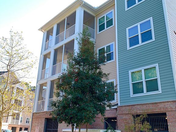 Exterior of the building with a convenient elevator. This condo spans the entire third floor with a wrap around screened in porch.