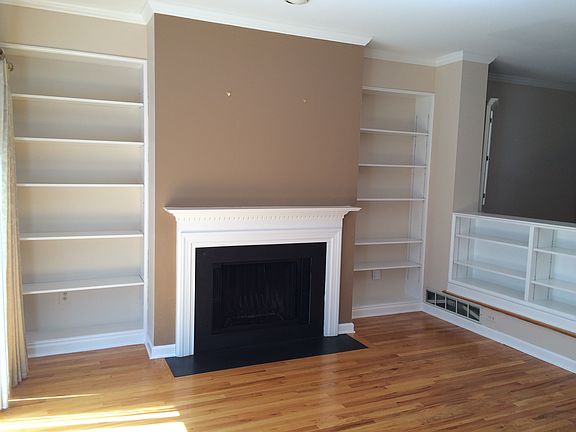 Living Room (LR) with working fireplace & built-in shelves