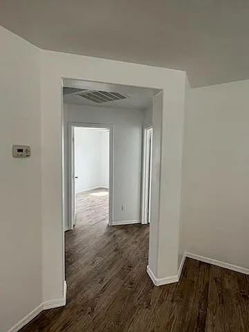 Split floor plan . The second and third bedroom , laundry and a shared bath are on the left side.