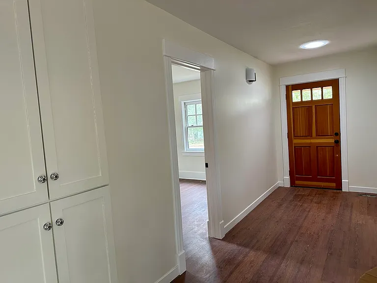 Front door entryway with north bedroom on left