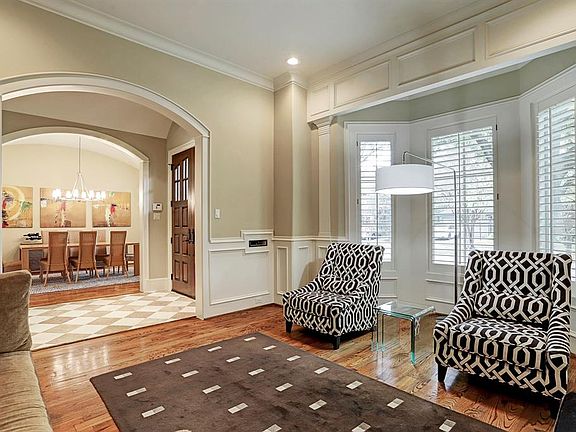 Both formals, with gleaming hardwoods, greet you upon entry.