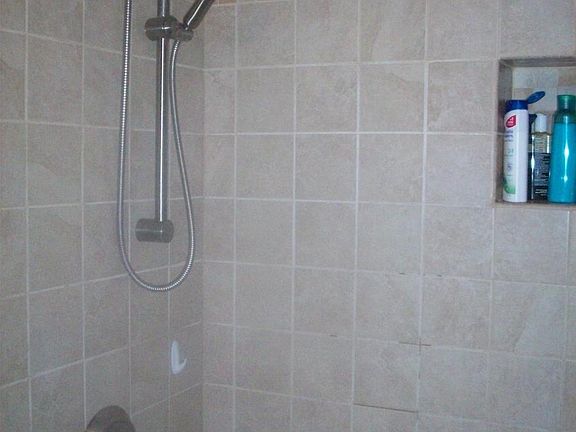 upstairs tile shower and whirlpool tub.