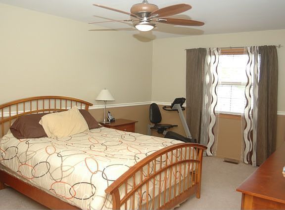 Spacious master suite with walk-in closet and private bath