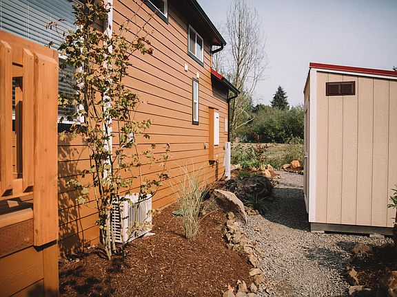 Walkway to storage shed amp seating area on creek.