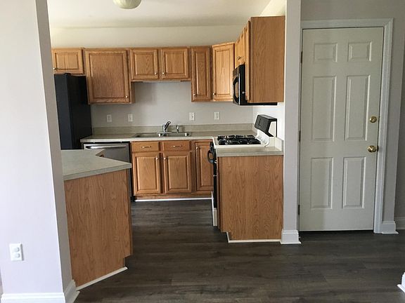 Open floor plan and modern appliances in the kitchen.