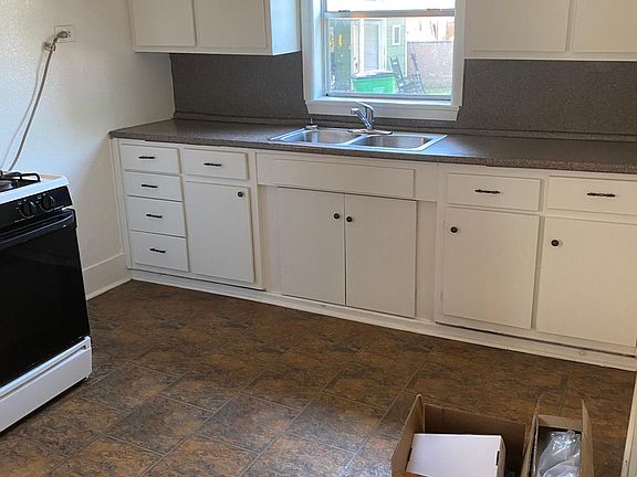 Kitchen, all new L shaped cabinetry, new stainless steel appliances (oven, microwave, dishwasher, garbage disposal). New flooring, new granite