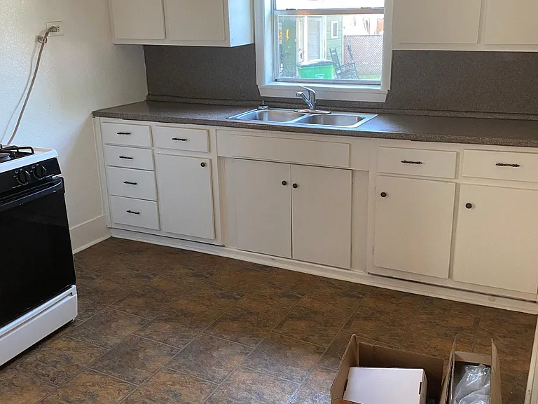Kitchen, all new L shaped cabinetry, new stainless steel appliances (oven, microwave, dishwasher, garbage disposal). New flooring, new granite