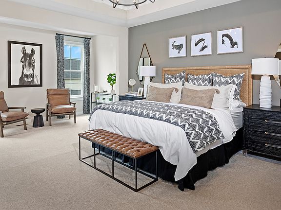 Carpeted owner s suite with 2 large windows In a DRB Homes Grable II model in the South Park communi