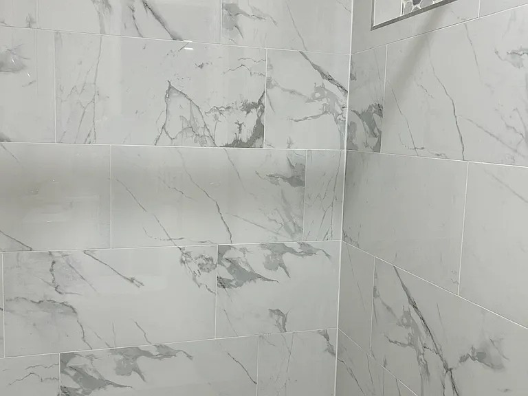 Fully renovated bathroom with stylish walk-in shower.