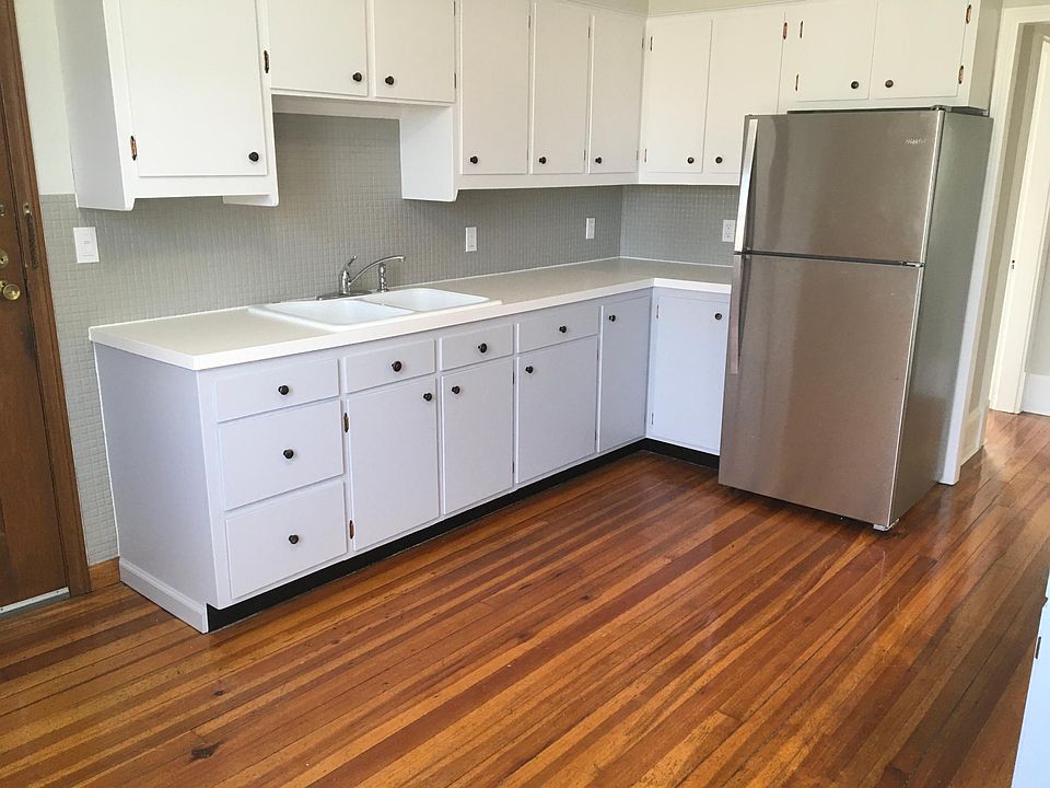 Two-tone cabinets; lots of storage and counter space, more cabinets and counter on opposite side