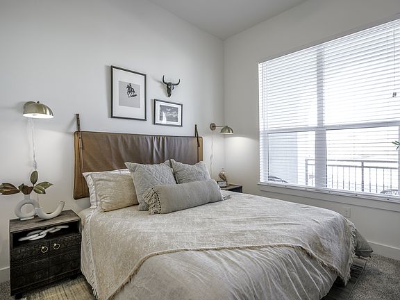 Embrace a bright and inviting living space as large windows invite an abundance of natural light into your home.