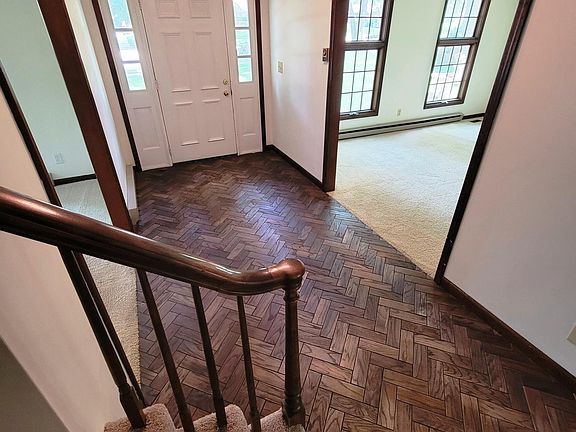 Entry with herringbone wood floor