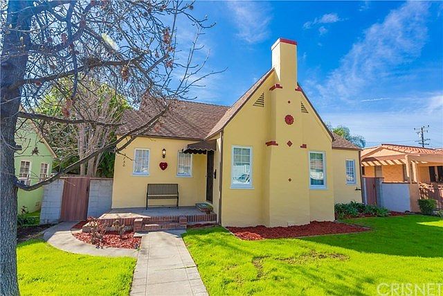 3 Bed Updated Spanish style home with newer roof, AC & windows yet retaining it's original charm.
