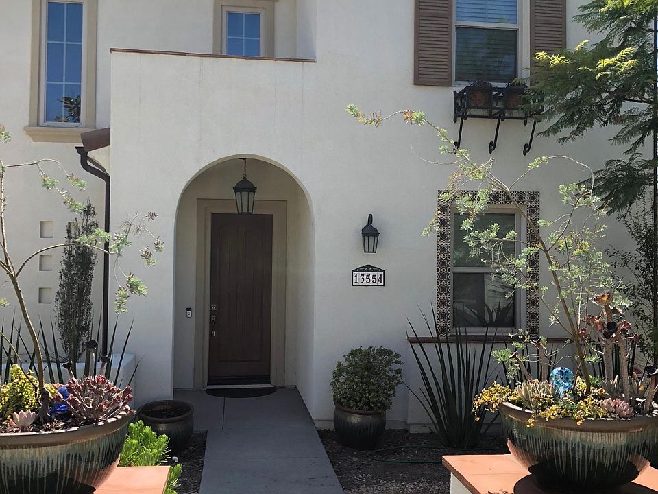 Street view of home. 3-Bay garage entry from alley in the ba