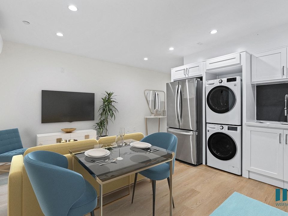 Open-Concept Kitchen, Dining, and Living Room Space with In-Suite Washer & Dryer